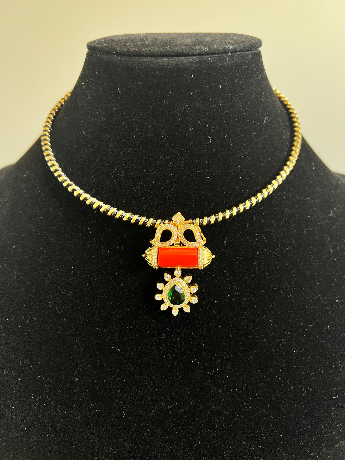 Coral Emerald pendant with Gold Hasli